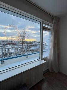 a large window in a room with a view at Apartment in Hafnarfjörður in Hafnarfjördur
