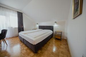 Postel nebo postele na pokoji v ubytování Hotel Maj Inn