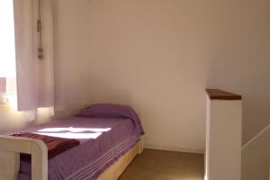 Letto o letti in una camera di Ammunaini