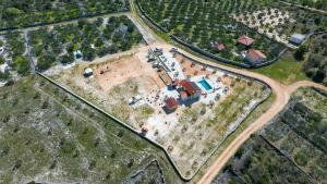 an aerial view of a house in a field at Holiday house OLIVE LAND in Gustirna