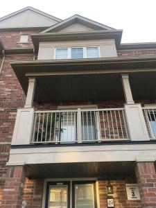 a house with a balcony on the front of it at Beautiful House in Brampton Area, ON Canada in Brampton