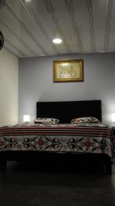 Postel nebo postele na pokoji v ubytování Hostal Queens Deluxe