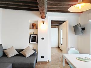 a living room with a couch and a table at S7Home in Parma