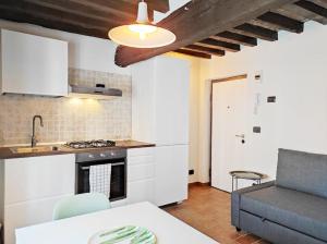 a kitchen with a sink and a stove top oven at S7Home in Parma