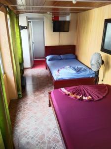 Кровать или кровати в номере Alojamiento Panamericano San Miguel