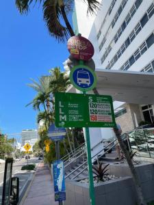 a street sign in front of a building at Amazing apartment in Miami Beach in Miami Beach