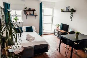 a living room with a couch and a table at O'Connell Place in Dublin