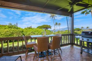 a patio with a table and chairs and a grill at K B M Resorts: Kaanapalii Plantation Villa KPL-55 Partial Ocean Views Includes Rental Car in Kaanapali