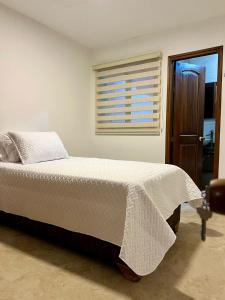 Posteľ alebo postele v izbe v ubytovaní Casa Akuaina