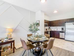 a kitchen with a table and chairs in a room at 1Bed/1Bath Pet Friendly Condo at the Melia in Orlando