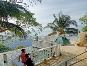 a view of the ocean from the balcony of a house at Cabin de Paulin 2 in Tagaytay