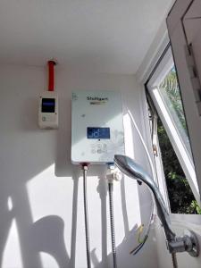 a machine in a room with a window at Cabin de Paulin 2 in Tagaytay