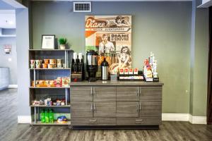 a liquor store with a counter with bottles and alcohol at Oasis at Gold Spike in Las Vegas