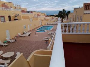 a balcony of a building with a swimming pool at campoamor 34 in Orihuela