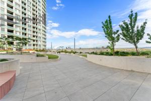 a walkway in front of a building at Bright 1-Bed by Natural Reserves with Pool & Gym in Harrison