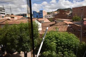 a view of a city with buildings and trees at Saga Andina II in Cusco
