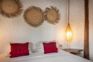Postel nebo postele na pokoji v ubytování Mawimbi Boutique Hotel