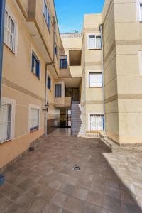 an empty courtyard of a building at A spacious and cozy apartment. in Torrevieja
