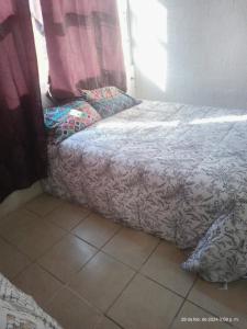 Un pat sau paturi într-o cameră la Casa de Fidel