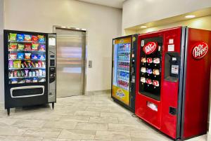 two coca cola machines are in a store at Quality Inn Fort Worth - Downtown East in Fort Worth