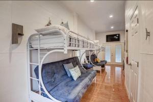 a room with two bunk beds and a couch at Lake Travis with Private Dock on Deep Water Cove in Lago Vista