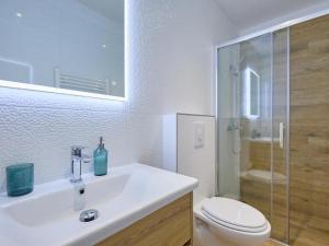 a bathroom with a sink and a toilet and a shower at Family friendly house with a swimming pool Babino Polje, Mljet - 22326 in Babino Polje +14 photos