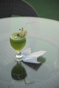 a drink sitting on top of a table at The Elet Signature Boutique Hotel in Karachi