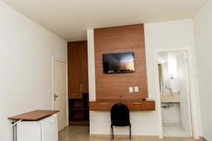 TV a/nebo společenská místnost v ubytování Hotel Fernandão