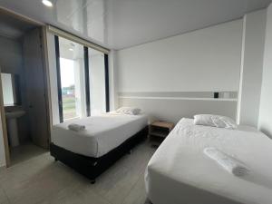 Postel nebo postele na pokoji v ubytování RB Hotel