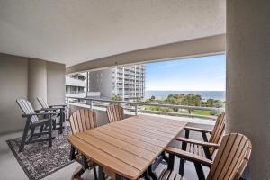 a table and chairs on a balcony with a view of the ocean at North Hampton #331 in Myrtle Beach