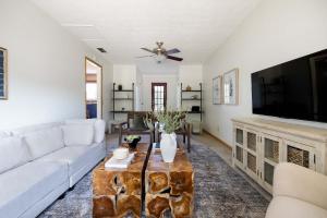 a living room with a couch and a tv at Turntable&Vinyl - Deck - Vibrant - Near IU in Bloomington