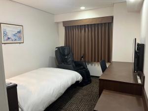 TV a/nebo společenská místnost v ubytování Hotel Alpha-One Yamaguchi Inter + 3 fotografie