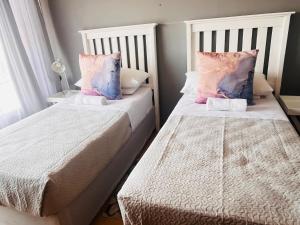 Cama o camas de una habitación en Lavender Lodge