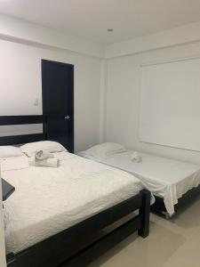 Cama o camas de una habitación en Hotel Las Gaviotas