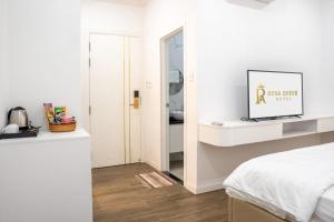 Postel nebo postele na pokoji v ubytování ROSA QUEEN HOTEL