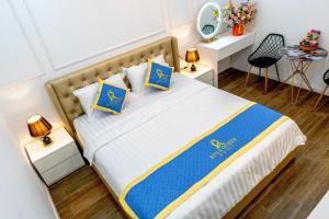 Postel nebo postele na pokoji v ubytování ROSA QUEEN HOTEL
