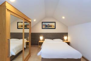 Giường trong phòng chung tại Pattaya Private Villa - Pool,Sauna,Snooker,BBQ +72 ảnh