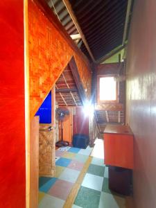 a room with a light shining into a room with a floor at Sea Esta Beach House in Boljoon