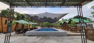 a swimming pool with a net over it at 3S Farm and Resort in San Antonio