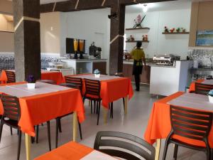 En restaurang eller annat matställe på Hotel Pousada Oasis