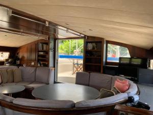 a living room with a couch and a table at Mawali Sunset & Overnight Cruise. in Kota Kinabalu