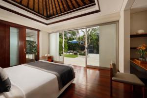 Ein Bett oder Betten in einem Zimmer der Unterkunft Villa Camellia by Nakula