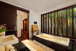Ein Bett oder Betten in einem Zimmer der Unterkunft Villa Camellia by Nakula