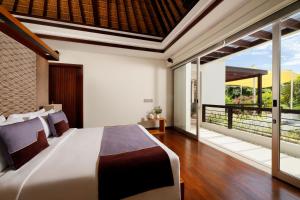 Ein Bett oder Betten in einem Zimmer der Unterkunft Villa Camellia by Nakula