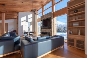 a living room with a couch and a fireplace at Ro-An in Kutchan +4 photos