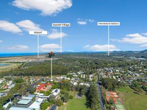 an aerial view of a city with street lights at Place au Soleil in Coffs Harbour