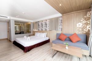 Ένα ή περισσότερα κρεβάτια σε δωμάτιο στο MATCHA SAMUI RESORT formerly Chaba Samui Resort