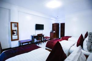 Lova arba lovos apgyvendinimo įstaigoje Doublegem Beach Resort and Hotel