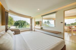 Ένα ή περισσότερα κρεβάτια σε δωμάτιο στο MATCHA SAMUI RESORT formerly Chaba Samui Resort