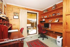a home office with a desk and a computer at Convenience location with large living areas in Kambah